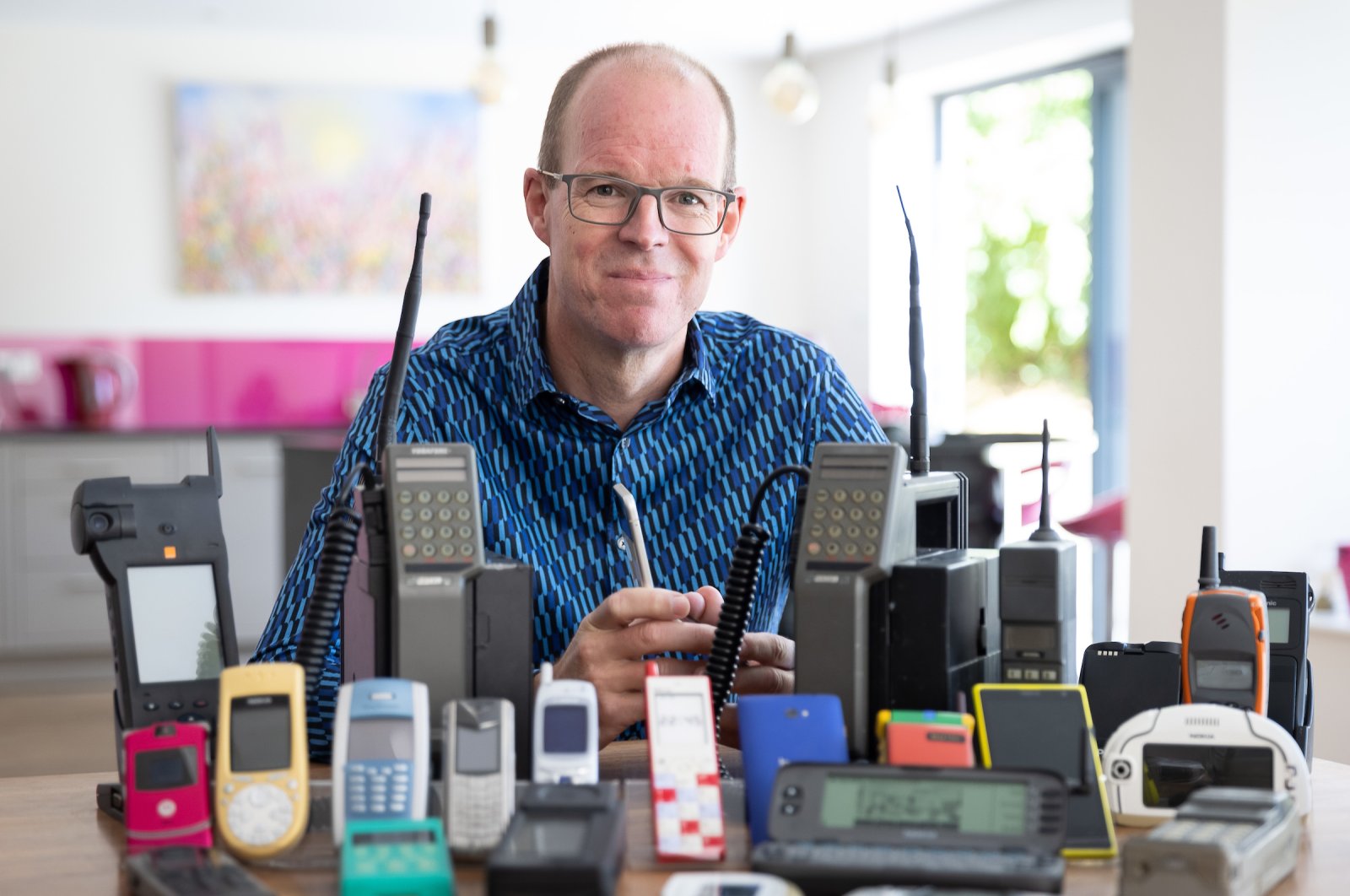 Ben Wood, founder of the Mobile Phone Museum, with some of the over 2,000 unique mobile phones that will be part of the online museum that launched in November. (DPA)