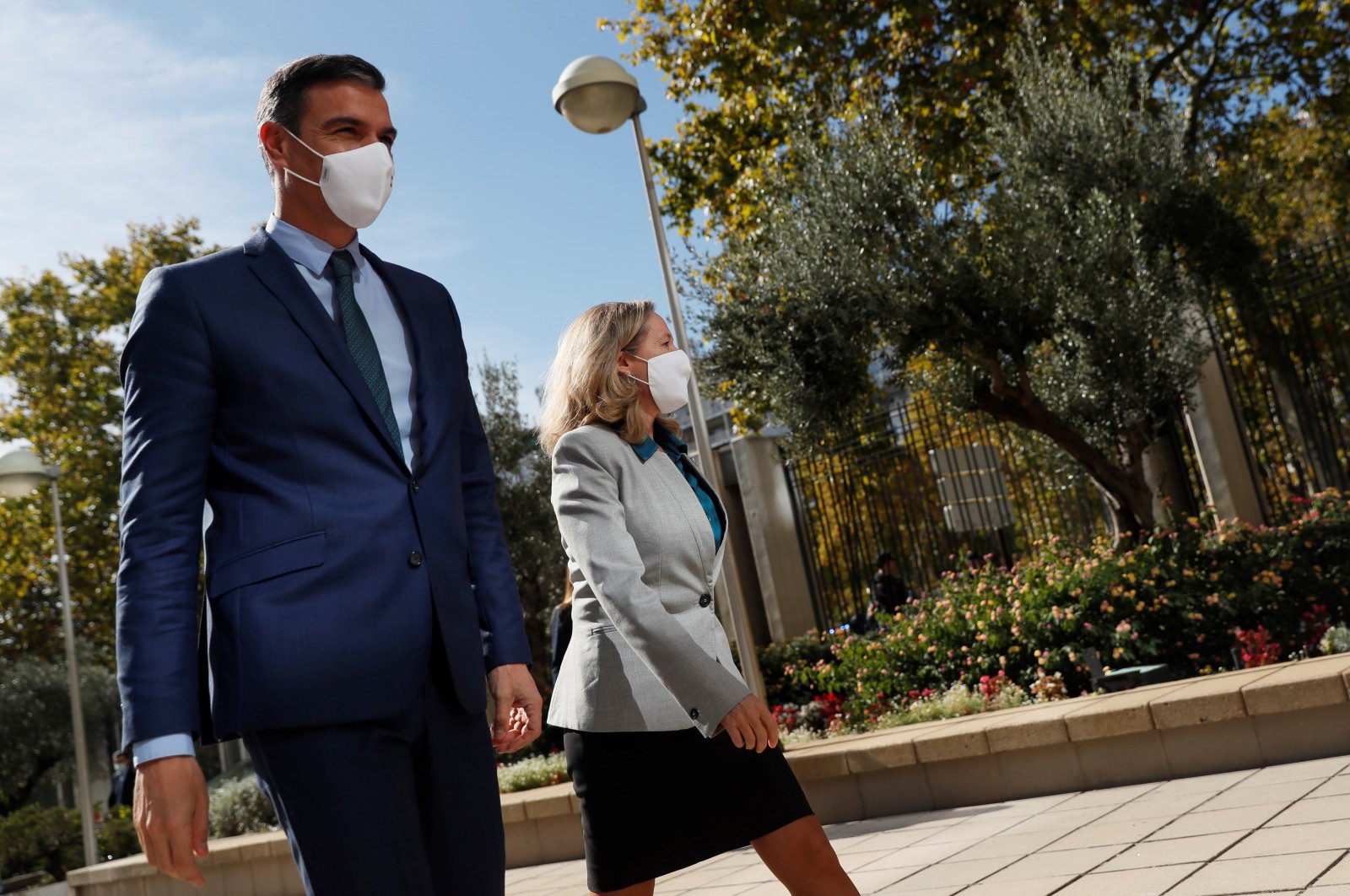 Spanish Prime Minister, Pedro Sanchez (L), and Spanish Deputy Prime Minister and Minister of Economy, Nadia Calvino, arrive to attend the closure of the seminar &quot;Monitoring the recovery: beyond GDP&quot; in Madrid, Spain, Oct. 25, 2021.  (EPA Photo)
