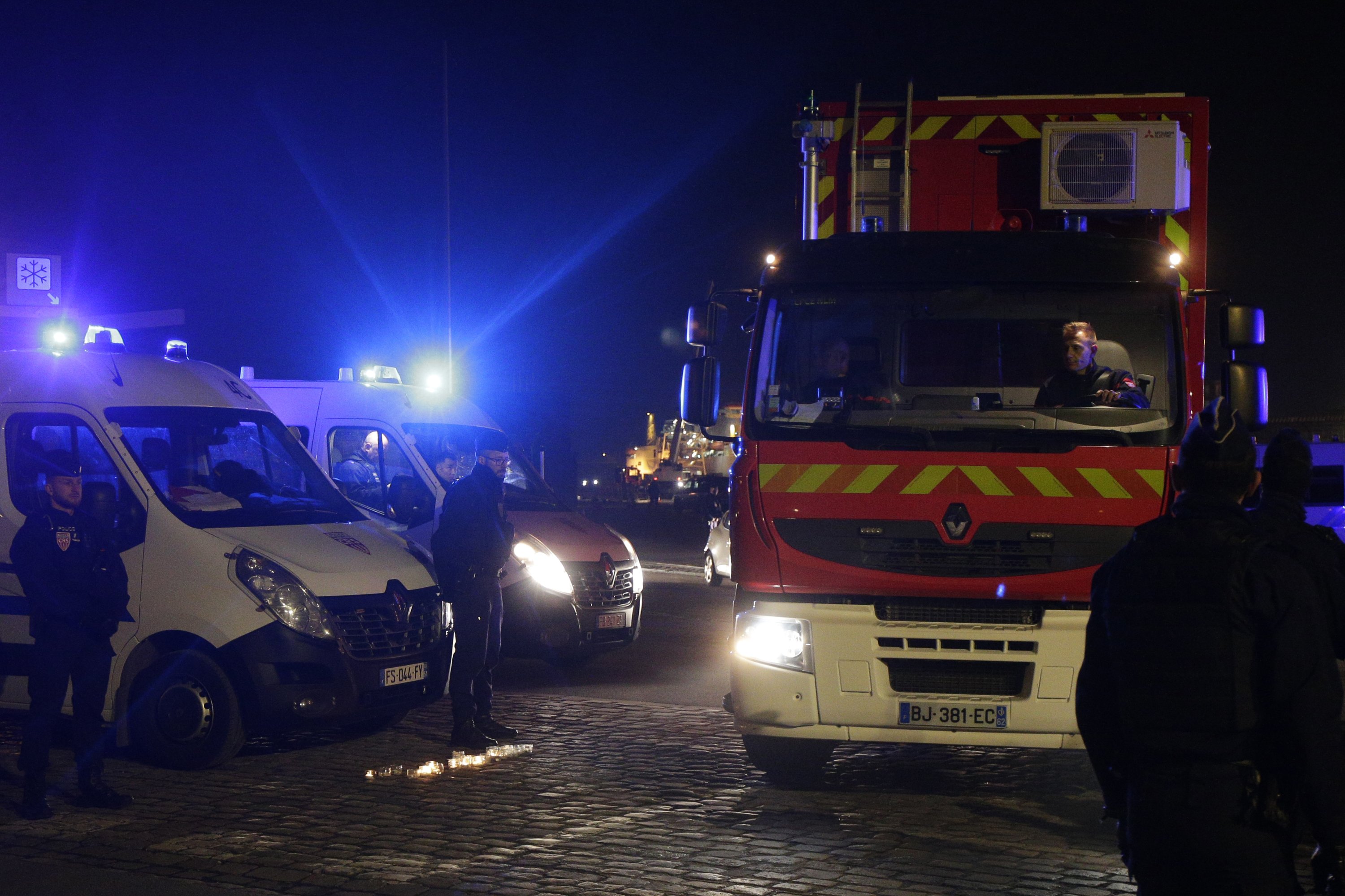 A rescue workers truck leaves the port of Calais, northern France, Nov. 24, 2021. (AP Photo)