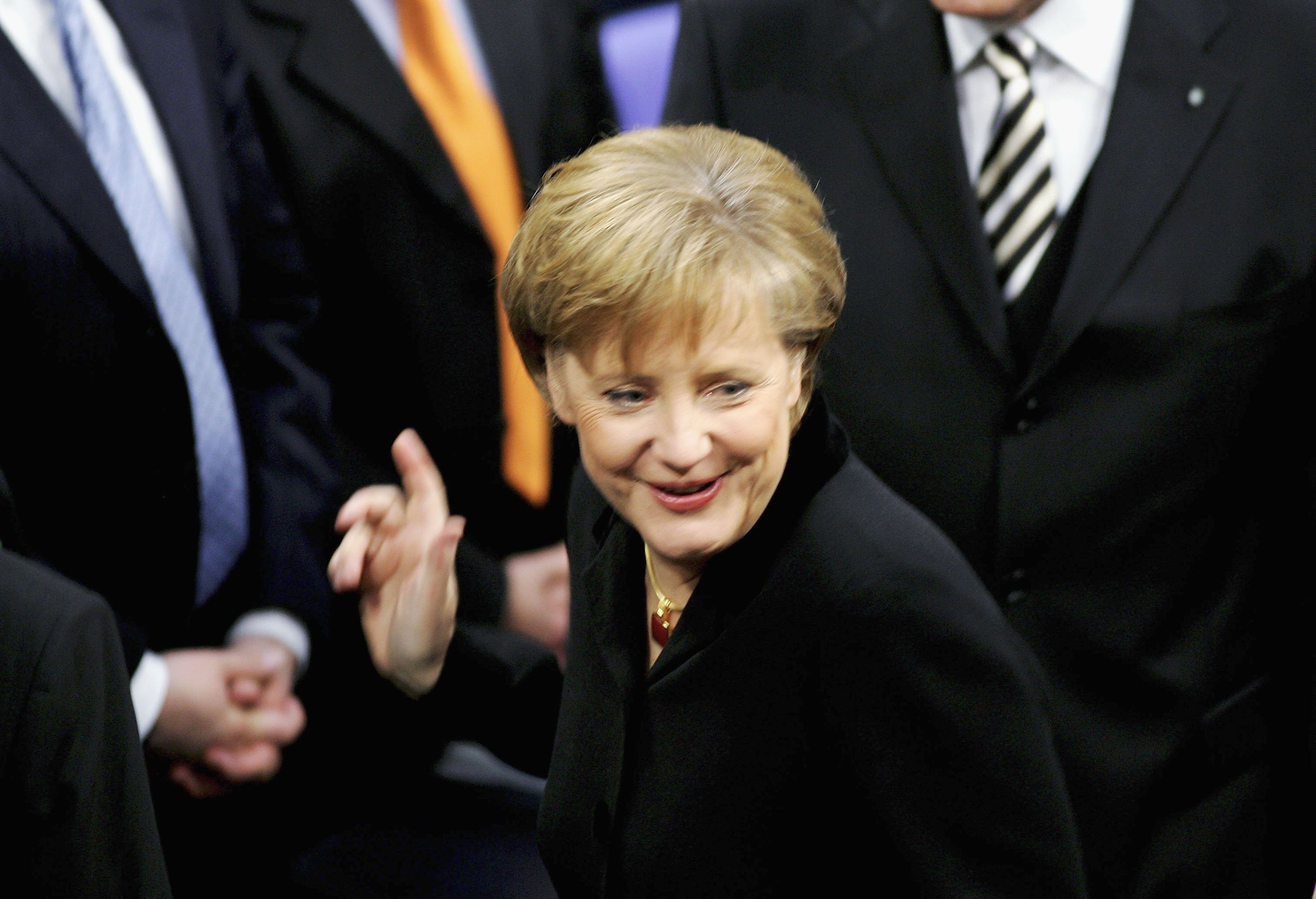 Angela Merkel of the Christian Democratic Union (CDU) smiles after being sworn in as new German chancellor at the Reichstag, Berlin, Germany, Nov. 22, 2005. (Photo by Getty Images)