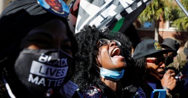 People react outside the Glynn County Courthouse after the jury reached a guilty verdict in the trial of William "Roddie" Bryan, Travis McMichael and Gregory McMichael, charged with the February 2020 death of 25-year-old Ahmaud Arbery, in Brunswick, Georgia, U.S., Nov. 24, 2021. (Reuters Photo)