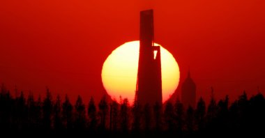 A view of skyscrapers Shanghai Jin Mao Tower and Shanghai World Financial Center during a sunset in Shanghai, China, Nov. 23, 2021. (Reuters Photo)