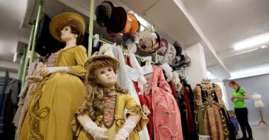 An employee works in a costume and props storage of the Barrandov Studio in Prague, Czech Republic, April 8, 2019. (REUTERS)