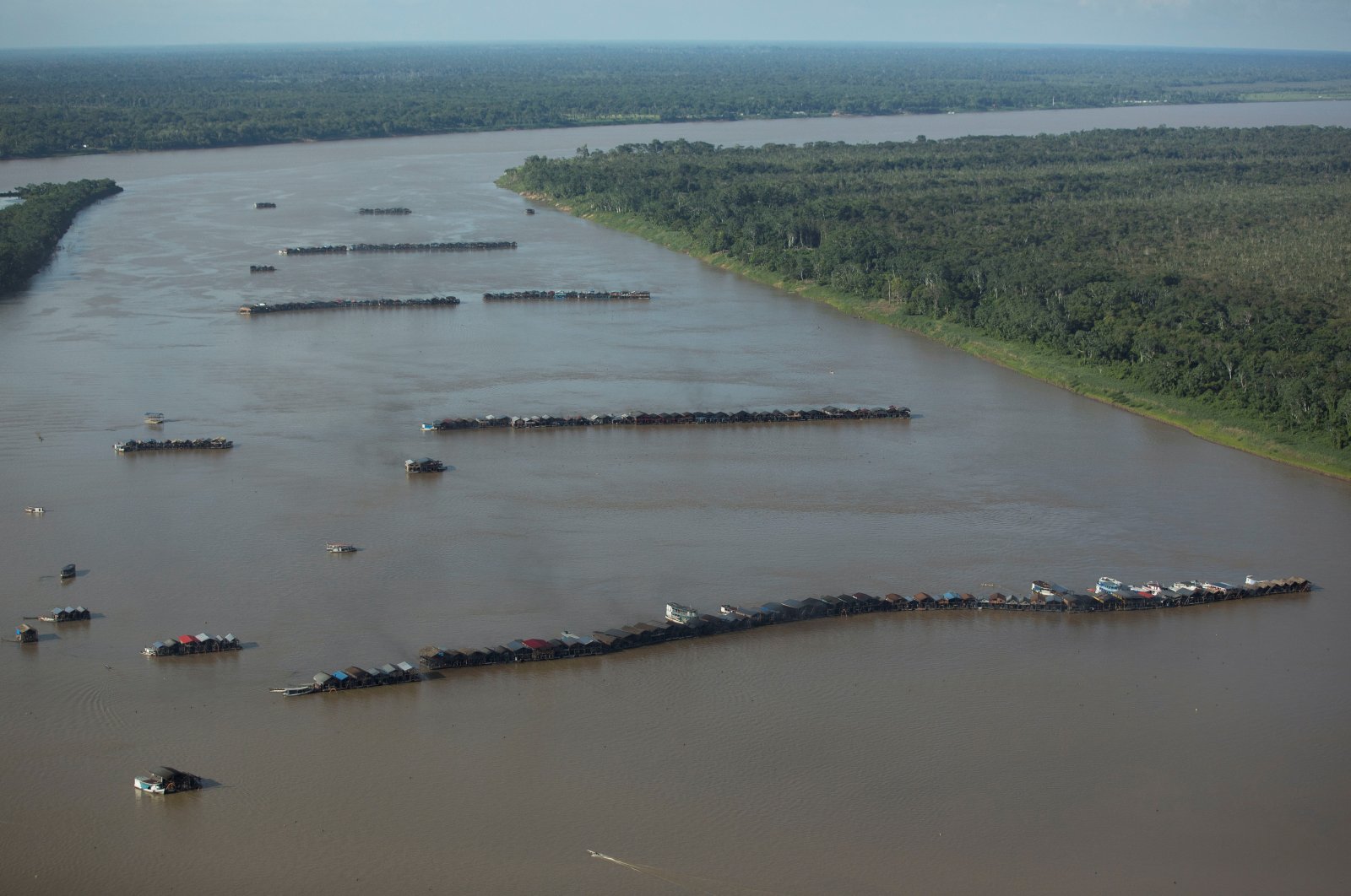An aerial view shows hundreds of dredging rafts operated by illegal miners who have gathered in a gold rush on the Madeira, a major tributary of the Amazon river in Autazes, Amazonas state, Brazil, Nov. 23, 2021. (Reuters Photo)