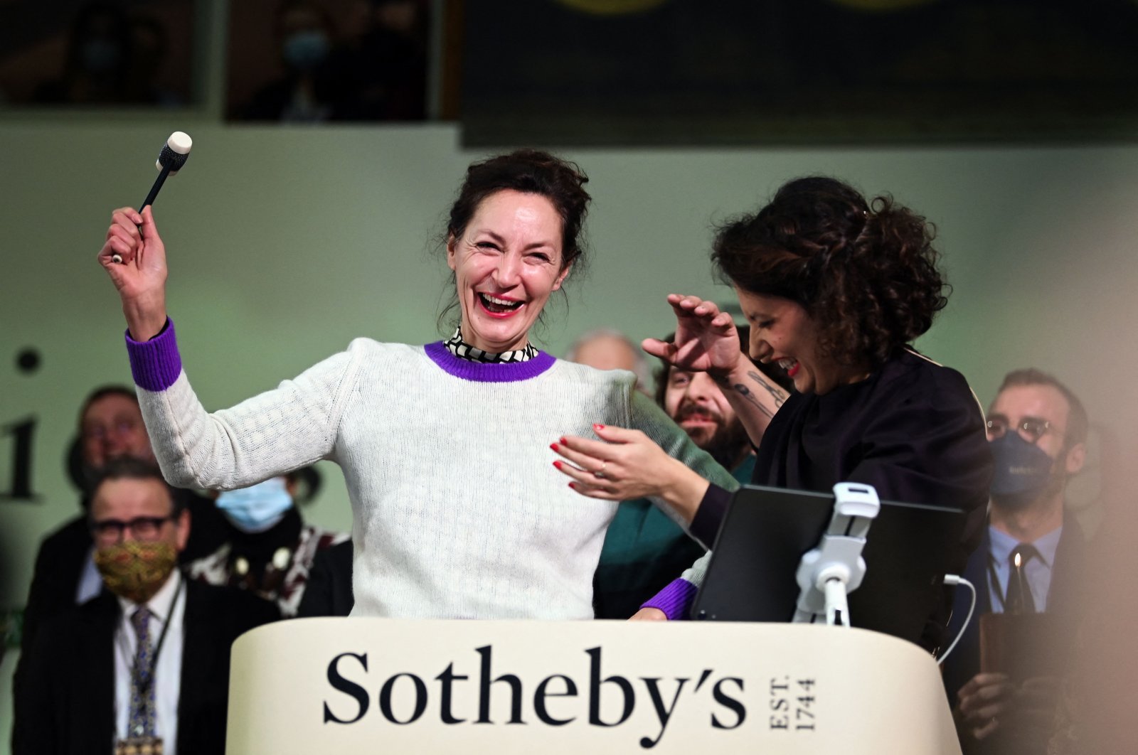 French actress Jeanne Balibar supervises the 161th charity wine action at the Hospices de Beaune, central France, Nov. 21, 2021. (AFP Photo)