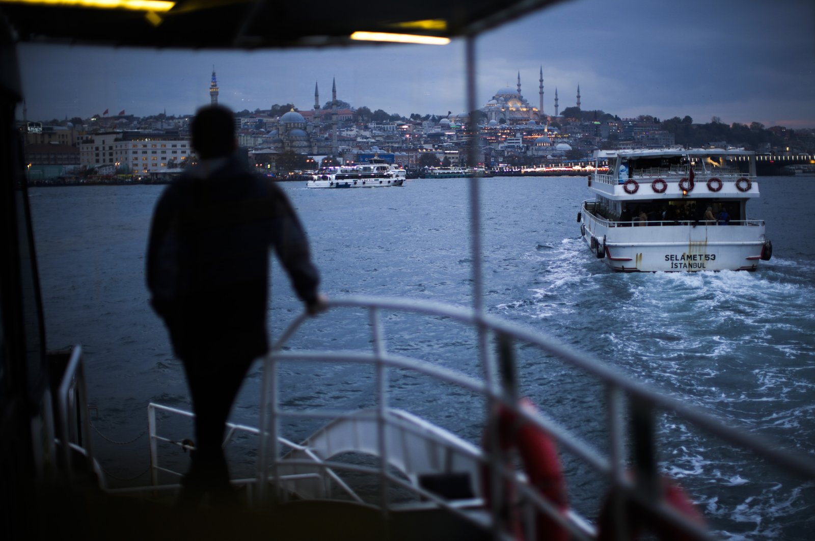 Ferries sail across the Bosporus towards the Eminönü district in Istanbul, Turkey, Nov. 19, 2021. (AP Photo)