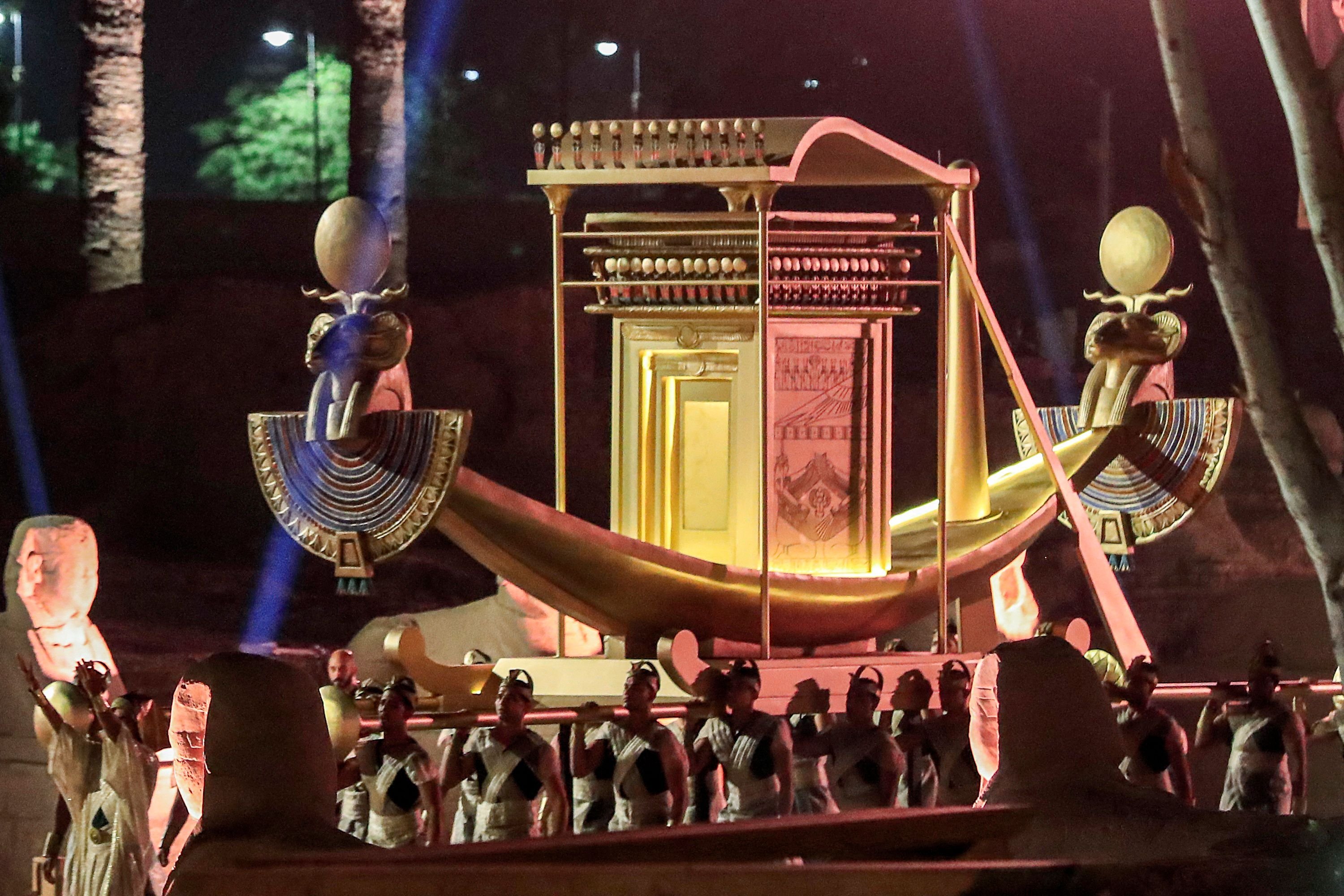 Performers carry a palanquin during the official ceremony opening the "Rams Road" near the Temple of Luxor (built around 1400 B.C.) in Egypt's southern city of the same name on Nov. 25, 2021. (AFP Photo)