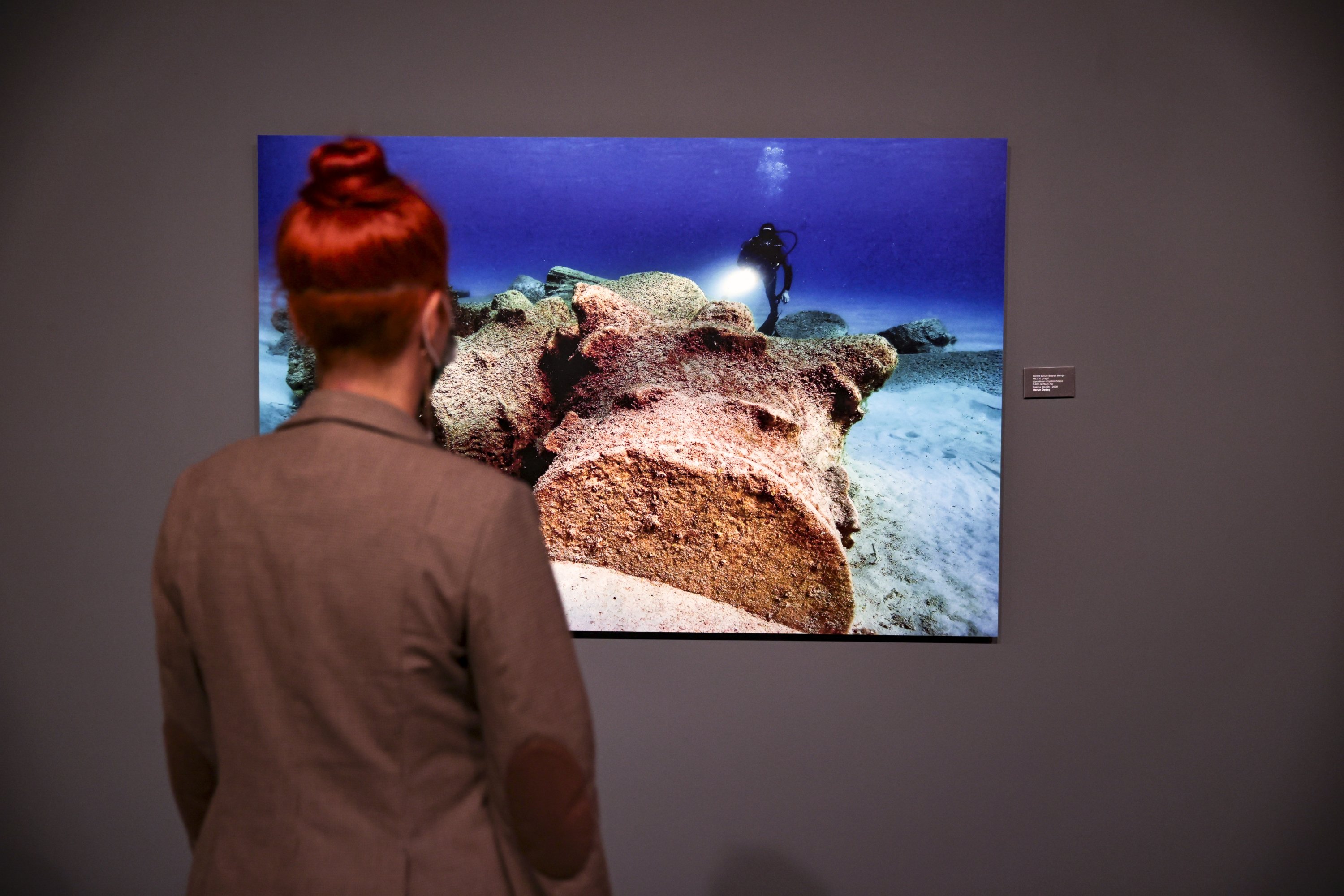 A visitor examines a photo revealing the underwater richness of Turkey at the “Blue Heritage” exhibition at CerModern in the capital Ankara, Turkey, Nov. 16, 2021. (AA Photo)