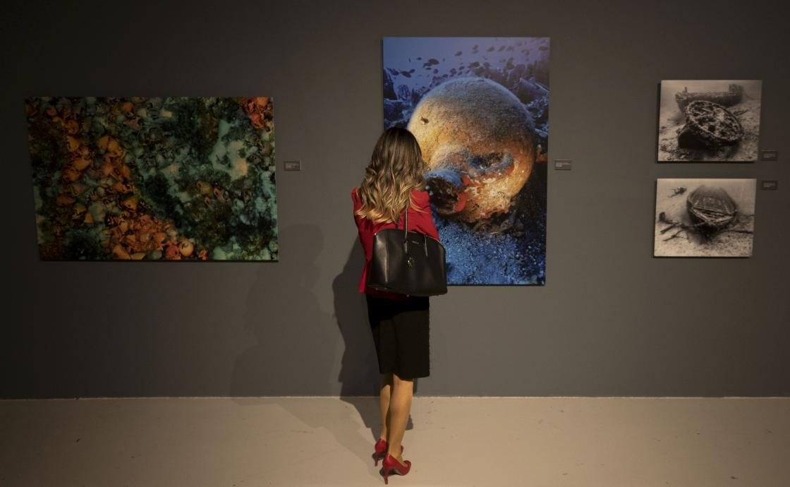 A visitor examines a photo revealing the underwater richness of Turkey at the “Blue Heritage” exhibition at CerModern in the capital Ankara, Turkey, Nov. 16, 2021. (AA)