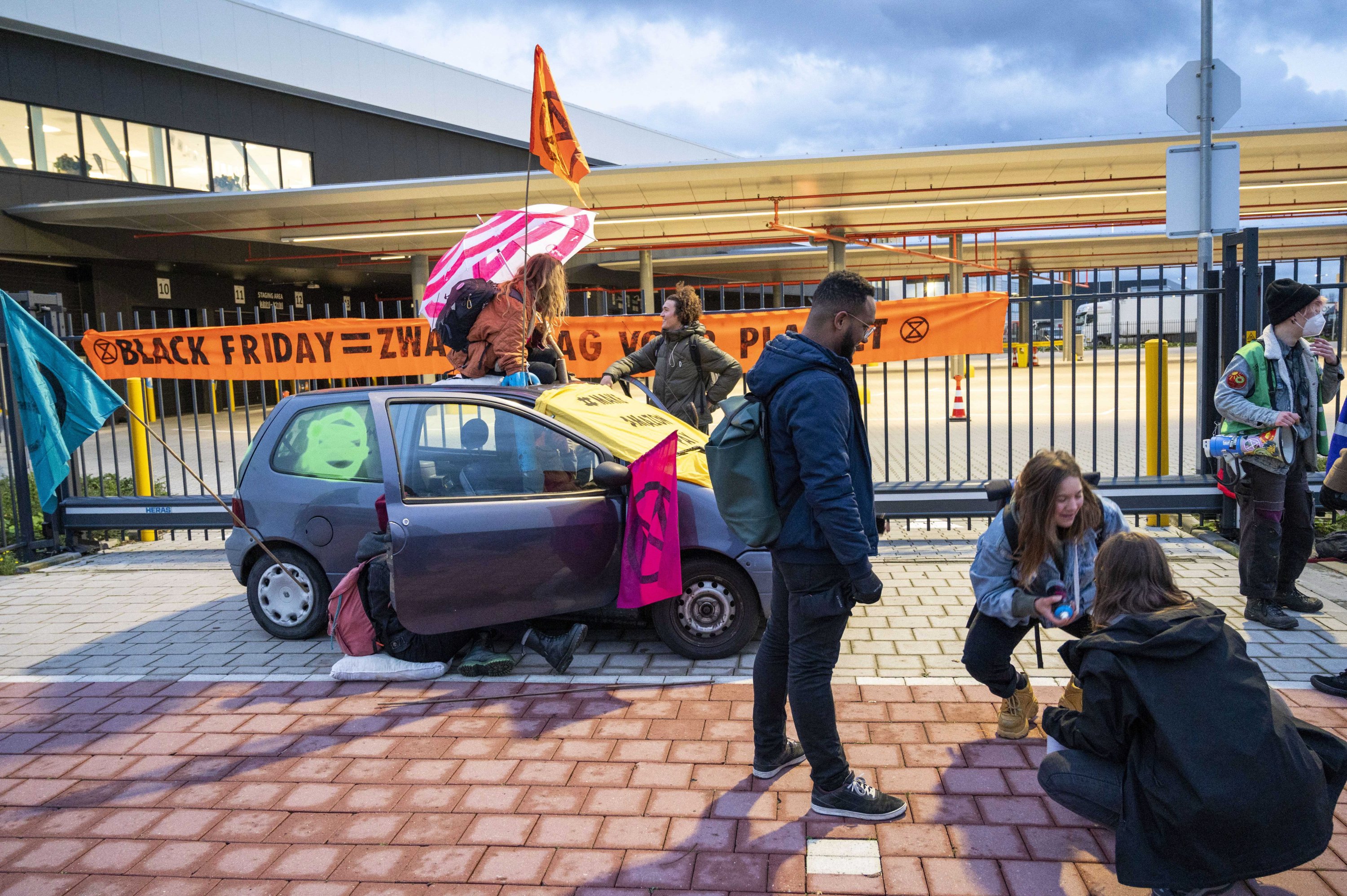 Extinction Rebellion activists block the access to the distribution center of e-commerce company Amazon in Rozenburg-Schiphol, the Netherlands, Nov. 26, 2021. (EPA Photo)