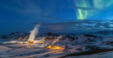 This handout photo made available by Iceland's National Power Company Landsvirkjun on Nov. 23, 2021 shows Krafla geothermal power plant near the Krafla volcano as northern lights can be seen in the background, in northern Iceland, April 14, 2018. ( LANDSVIRKJUN via AFP)