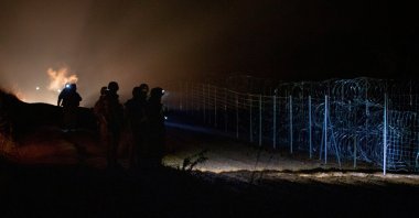 Polish service members patrol in this image released by the Ministry of National Defense of Poland, the Polish-Belarusian border, Poland, Nov. 24, 2021. (Ministry of National Defense of Poland (MON)/Handout via Reuters)