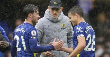 Chelsea's head coach Thomas Tuchel, center, celebrates with Ben Chilwell, left, and Cesar Azpilicueta after the English Premier League soccer match between Chelsea and Southampton at Stamford Bridge Stadium in London, Saturday, Oct. 2, 2021. (AP Photo)