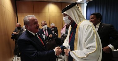 Parliament Speaker Mustafa Şentop and Qatar’s Shura Council Speaker Hassan bin Abdullah Al-Ghanim (R) shake hands at the 143rd Inter-Parliamentary Union Assembly, Madrid, Spain, Nov. 26, 2021. (AA Photo)