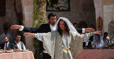 Actor Mehmet Akif Alakurt (L) and Cansu Dere in a still shot from "Sıla," a series broadcast on ATV.