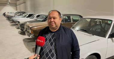 Classic car-lover Erdinç Başsimitçi, 40, seen in front of his classic vehicle collection, Gaziantep, Turkey, Nov. 25, 2021. (DHA Photo)