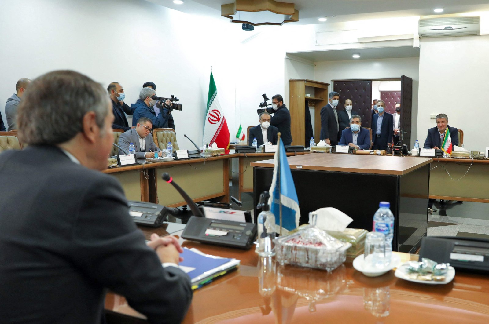 The Director General of the International Atomic Energy Agency Rafael Grossi (L) meets with the Head of Iran&#039;s Atomic Energy Organization Mohammad Eslami (R) during a press conference in the capital Tehran in the capital Tehran on Nov. 23, 2021. (Photo by Atomic Energy Organization of Iran / AFP)