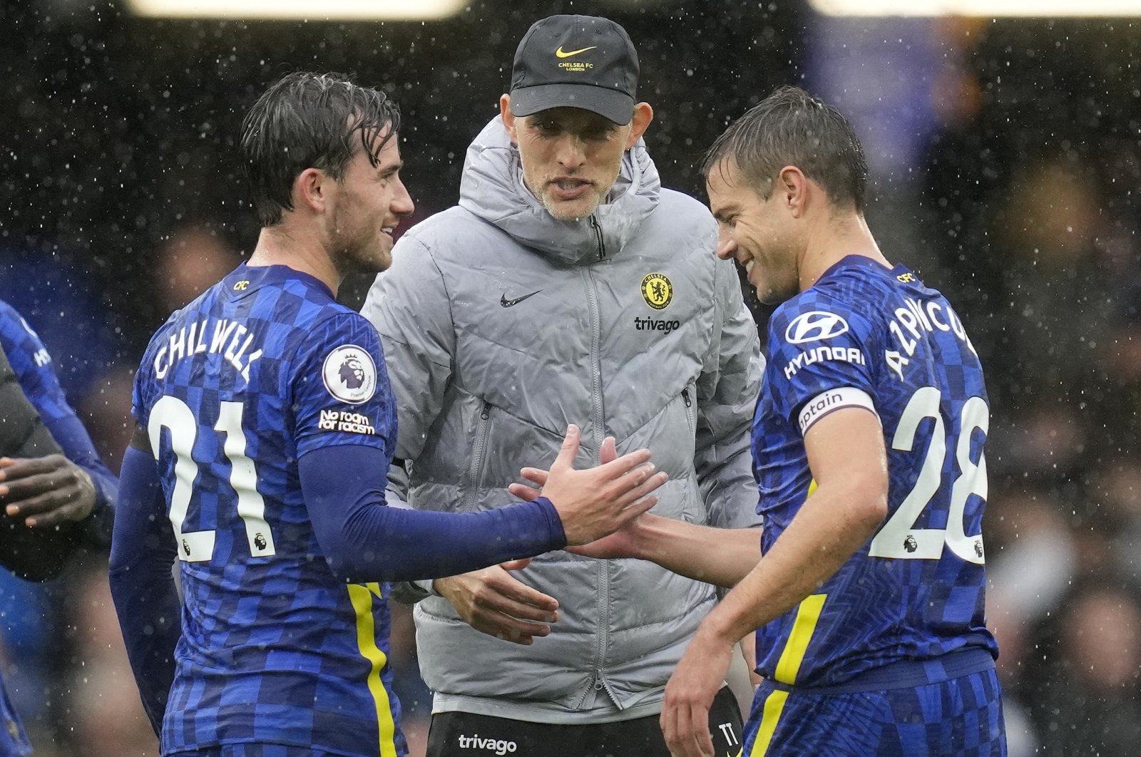 Chelsea&#039;s head coach Thomas Tuchel, center, celebrates with Ben Chilwell, left, and Cesar Azpilicueta after the English Premier League soccer match between Chelsea and Southampton at Stamford Bridge Stadium in London, Saturday, Oct. 2, 2021. (AP Photo)