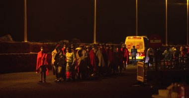 About 81 migrants, who traveled in two boats and who were rescued by Spanish Sea Rescue, arrive at Arrecifes port, in Lanzarote, Canary Islands, Nov. 22, 2021. (EPA/JAVIER FUENTES)