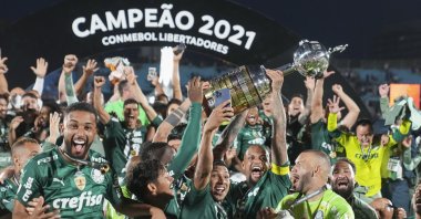 Palmeiras players celebrate with the trophy after beating Flamengo 2-1 in Copa Libertadores final Montevideo, Uruguay, Nov. 27, 2021. (AP Photo)