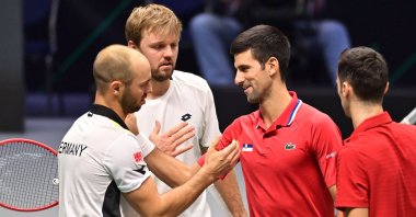 Germany&#039;s Kevin Krawietz (2nd L) and Tim Puetz (L) are congratulated by Serbia&#039;s Novak Djokovic (2nd R) and Nikola Cacic (R) at the end of the men&#039;s doubles group stage Davis Cup match, Innsbruck, Austria, Nov. 27, 2021. (AFP Photo)