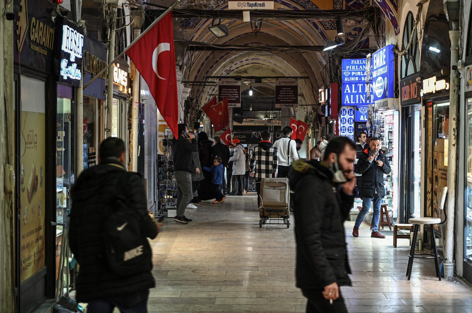 Pedestrians walk inside the Grand Bazaar in Istanbul, Turkey, Nov. 24, 2021. (AFP Photo)