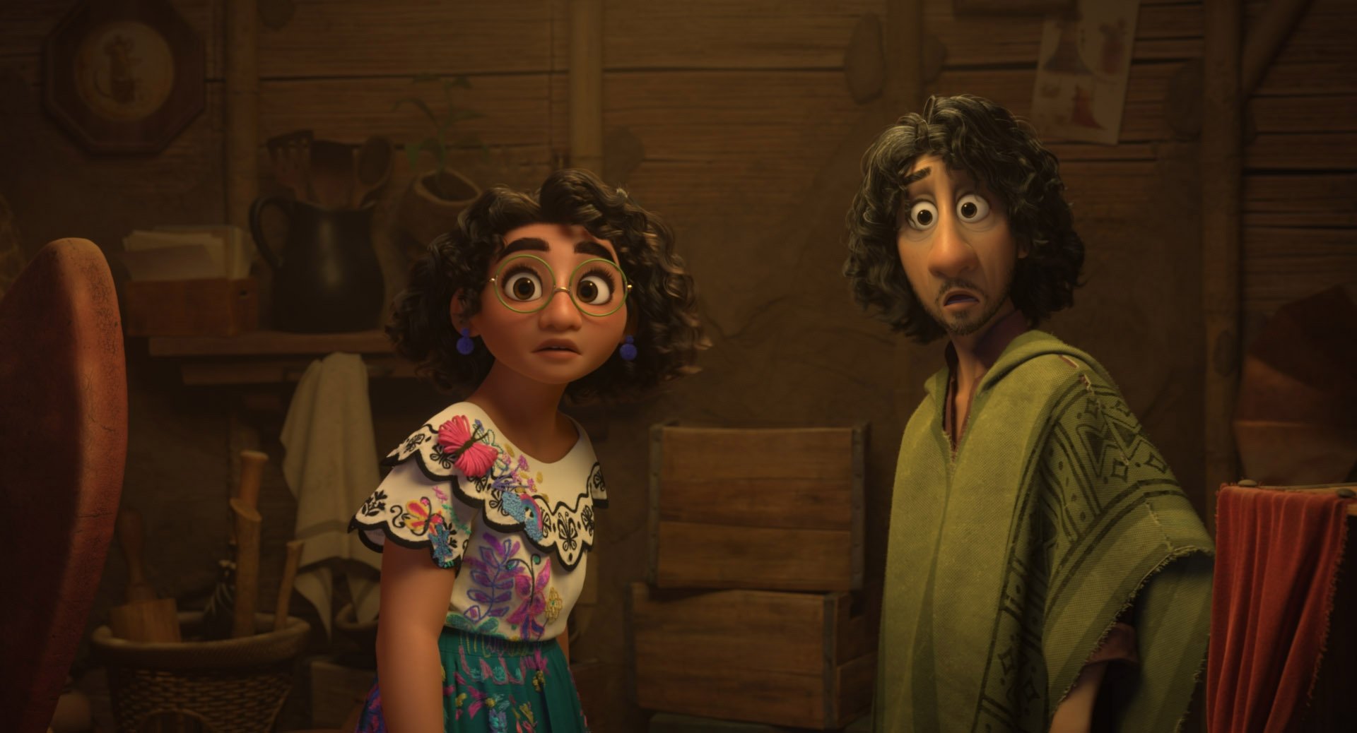 This image released by Disney shows Mirabel, voiced by Stephanie Beatriz (L) and Bruno, voiced by  John Leguizamo, in a scene from the animated film 