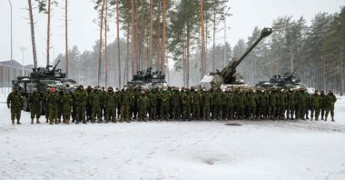 Canadian military troops stand guard for a picture at the Adazi military base, Latvia, Nov. 29, 2021. (AFP Photo)