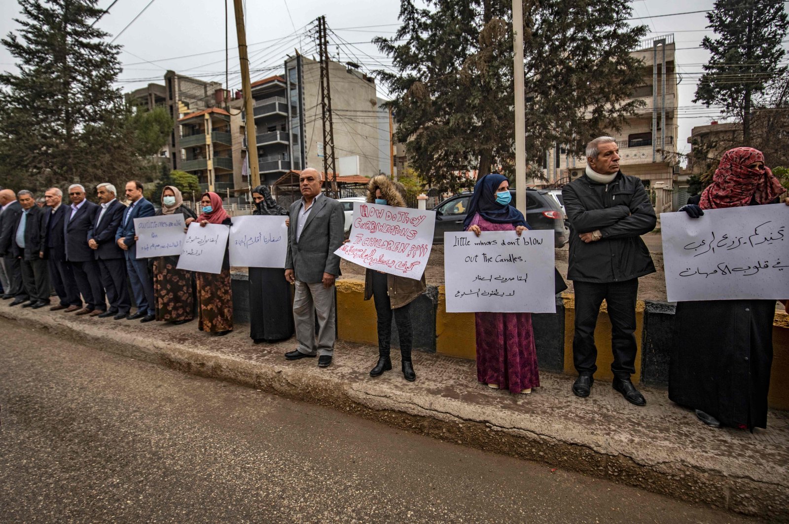 Kurdish parents demonstrate outside a U.N. building, calling on authorities to help release young girls they say were abducted and recruited into fighting by YPG/PKK, in the northeast city of Qamishli on Nov. 28, 2021. (AFP Photo)