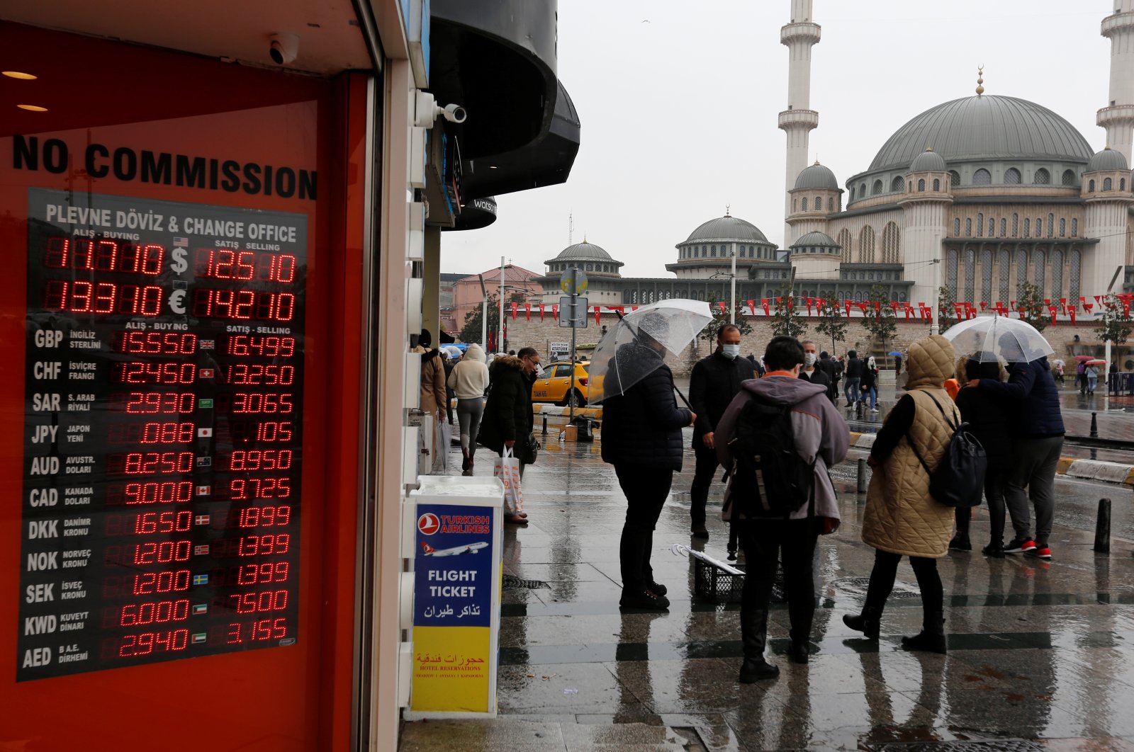People stand outside a currency exchange office in Istanbul, Turkey, Nov. 23, 2021. (Reuters Photo)