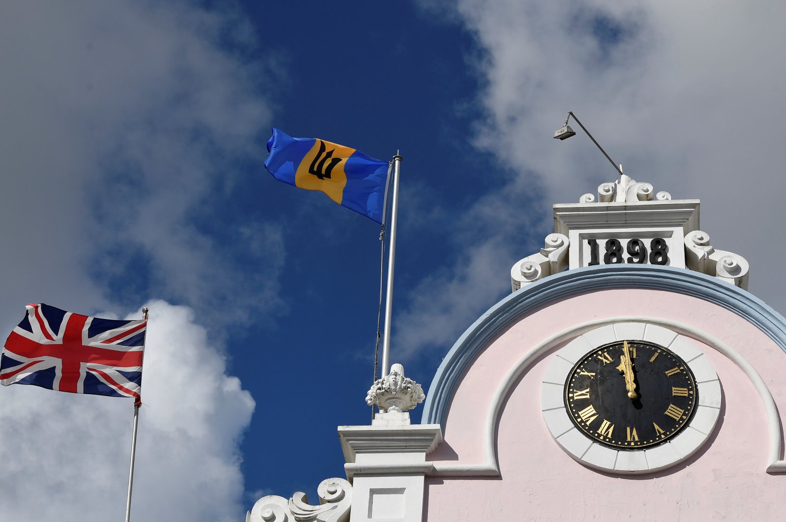 The British Union flag and the national flag of Barbados fly next to each other on a building as preparations take place to mark the Caribbean island&#039;s transition to a republic, in Bridgetown, Barbados, Nov. 29, 2021. (Reuters Photo)