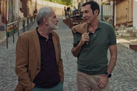 A still shot from “Not So Neighbourly Affair” shows Branko Duric (R) as Enis and Izudin Bajrovic as Izo.