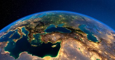 Planet Earth is lit by the lights of large cities, with Turkey seen at the center. (Photo by Shutterstock)