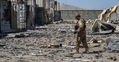 In this file photo, a member of the Taliban Badri 313 military unit walks amid debris of the destroyed Central Intelligence Agency (CIA) base in Deh Sabz district northeast of Kabul after the U.S. pulled all its troops out of the country, Kabul, Afghanistan, Sept. 6, 2021 (AFP Photo)