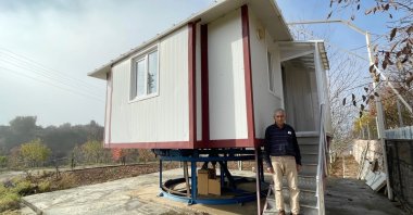 Ahmet Koca is seen in front of the rotating house he built, Muğla, Turkey, Nov. 30, 2021. (AA Photo)
