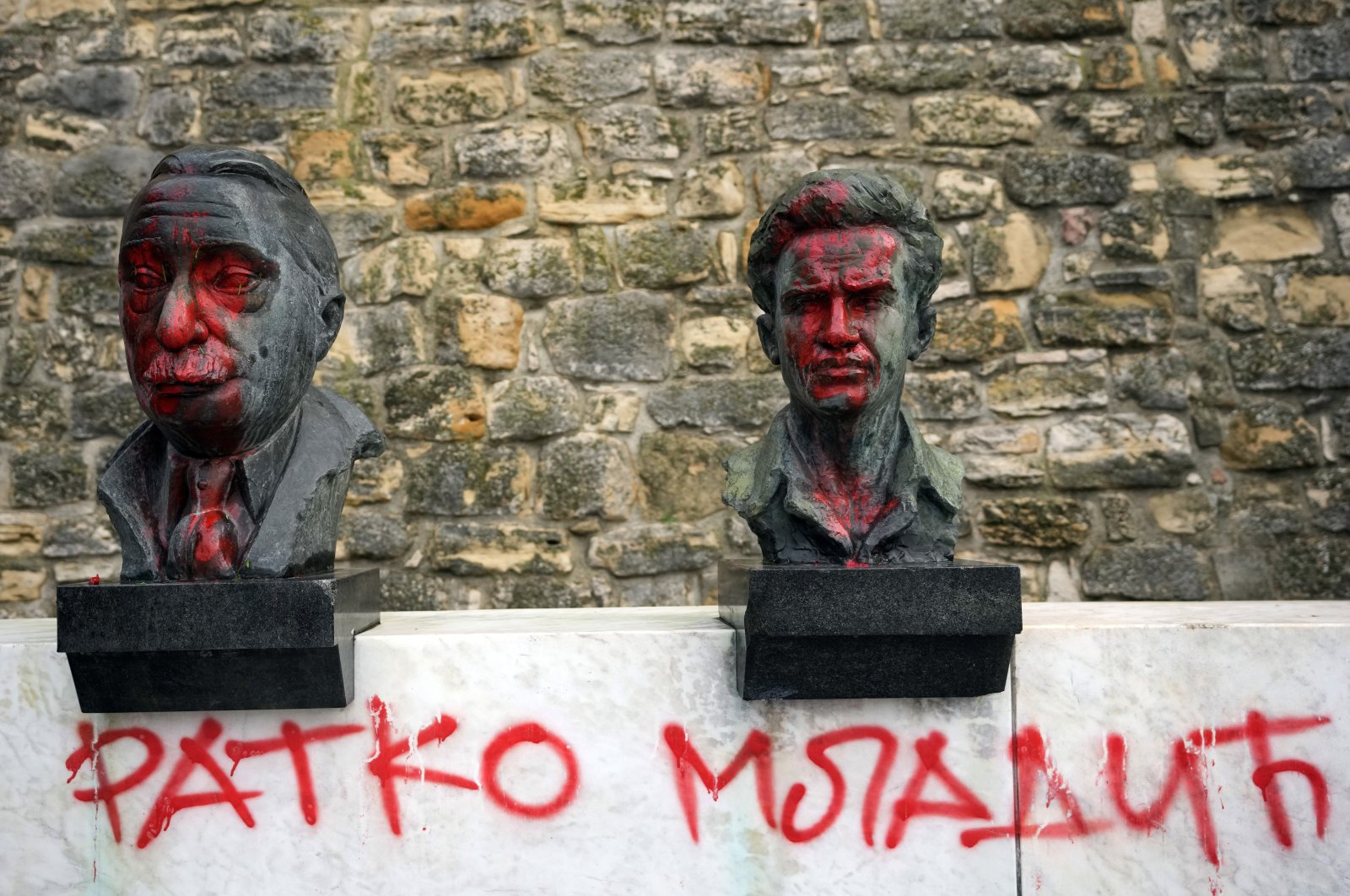 Red-colored graffiti in support of Bosnian Serb war criminal Ratko Mladic on a monument honoring World War II partisan anti-Nazi fighters and Yugoslav-era national heroes at the Kalemegdan fortress in Belgrade, Serbia, Nov. 29, 2021. (AP Photo)