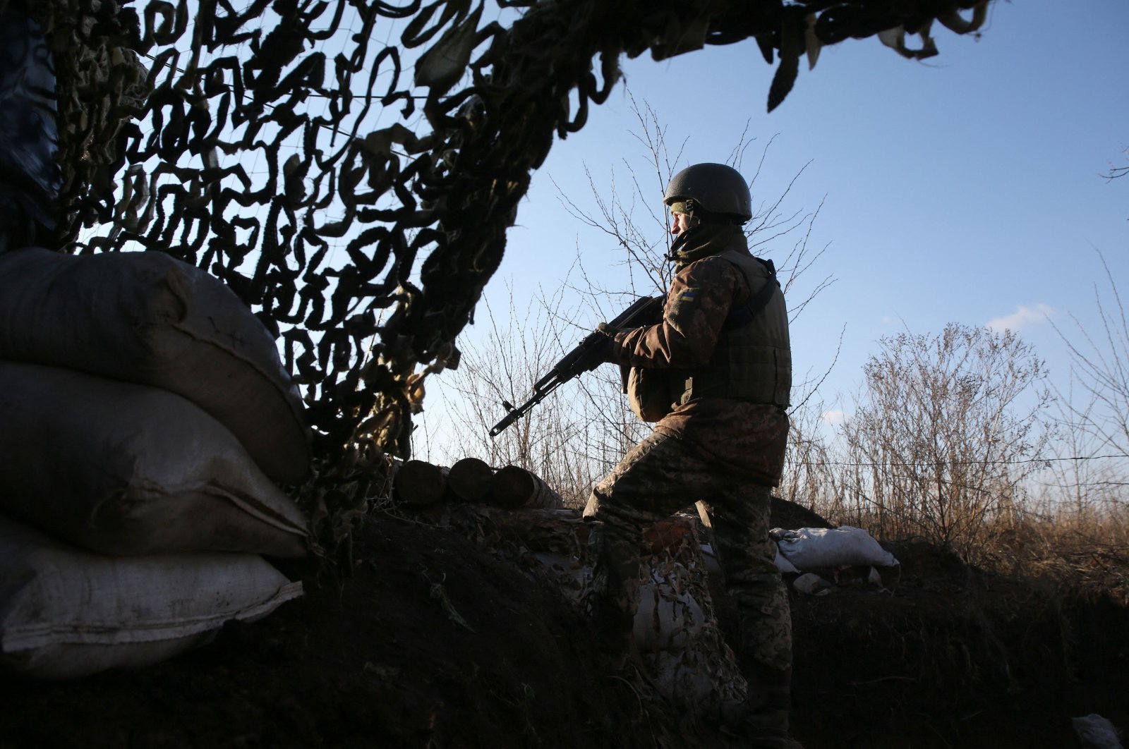 A Ukrainian soldier keeps watch at a position on the frontline with Russia-backed separatists not far from Gorlivka, Donetsk region, Ukraine, Nov. 25, 2021. (AFP Photo)