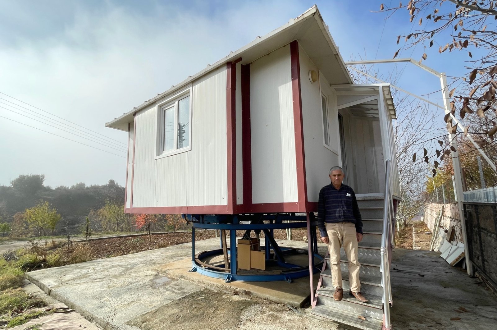Ahmet Koca is seen in front of the rotating house he built, Muğla, Turkey, Nov. 30, 2021. (AA Photo)