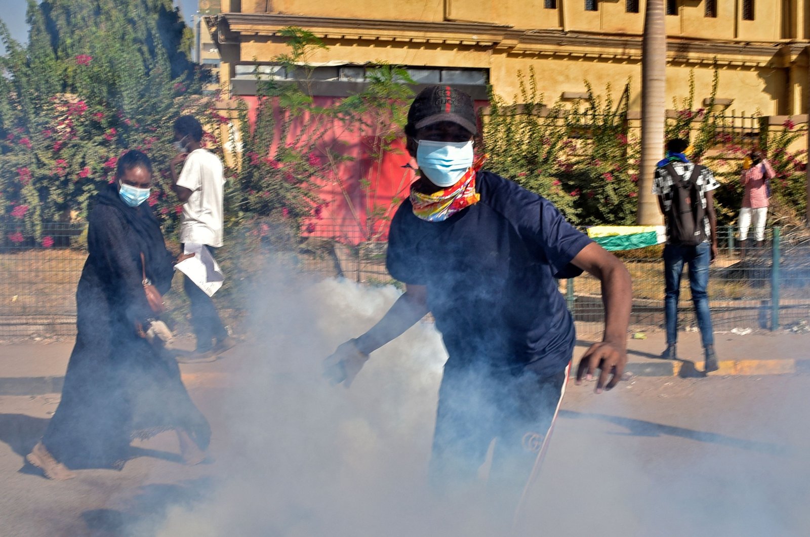 Demonstrators hurl tear gas canisters back at security forces amidst clashes in the center of Sudan&#039;s capital Khartoum, Nov. 30, 2021 following protests against a deal that saw the civilian prime minister reinstated after the military coup in October. (AFP Photo)
