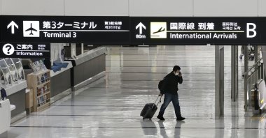 An international arrivals lobby is deserted at Narita International Airport, Narita, east of Tokyo, Japan, Nov. 29, 2021. (Kyodo News Photo via AP)