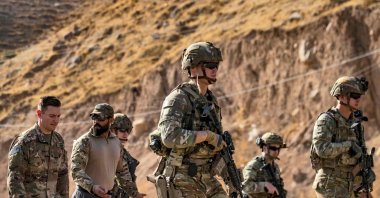 In this file photo, U.S. soldiers patrol an area near Syria's northeastern Semalka border crossing with Iraq's Kurdistan Regional Government (KRG), Nov. 1, 2021. (AFP Photo)