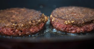 In this photo illustration, two patties of Beyond Meat &quot;The Beyond Burger&quot; cook in a skillet, June 13, 2019 in New York, US. (Getty Images via AFP)