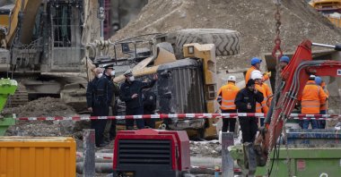 Firefighters, police officers and railway employees are seen at a railway site in Munich, Germany, Dec. 1, 2021. (AP Photo)