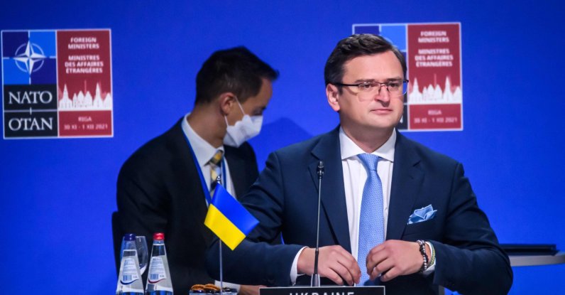 Ukraine's Foreign Minister Dmytro Kuleba (R) attends a session of a NATO Foreign Ministers meeting with Georgia and Ukraine on December 1, 2021 in Riga, Latvia. (AFP Photo)