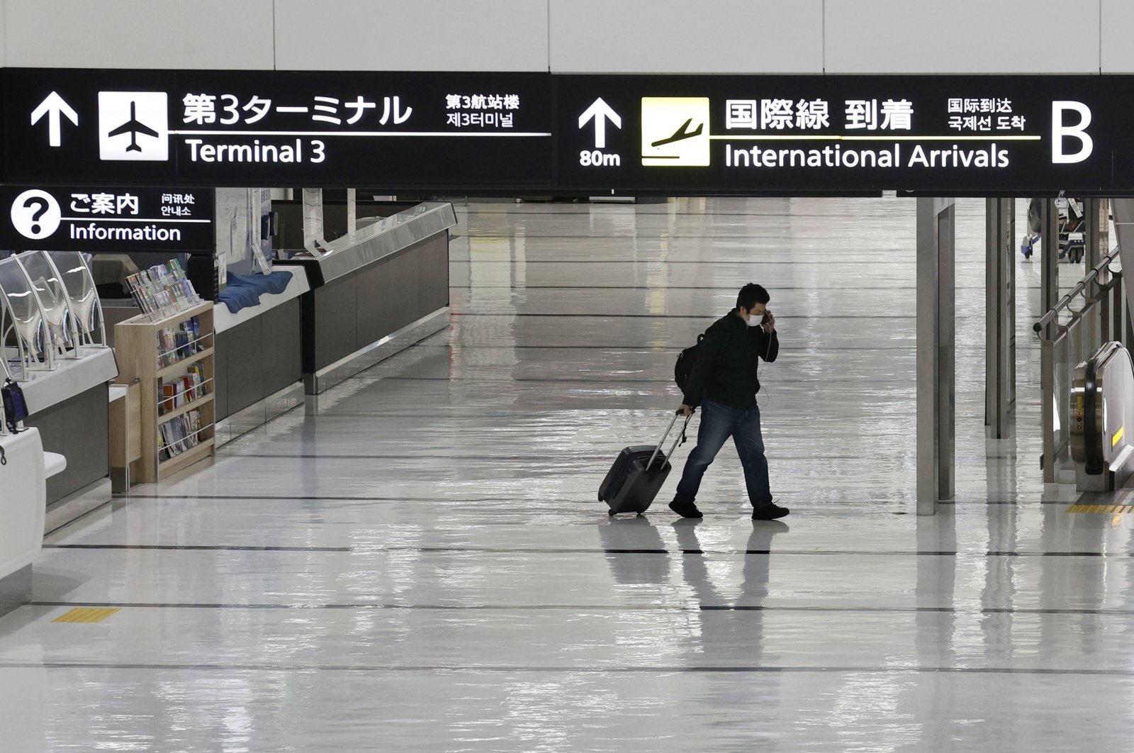 An international arrivals lobby is deserted at Narita International Airport, Narita, east of Tokyo, Japan, Nov. 29, 2021. (Kyodo News Photo via AP)