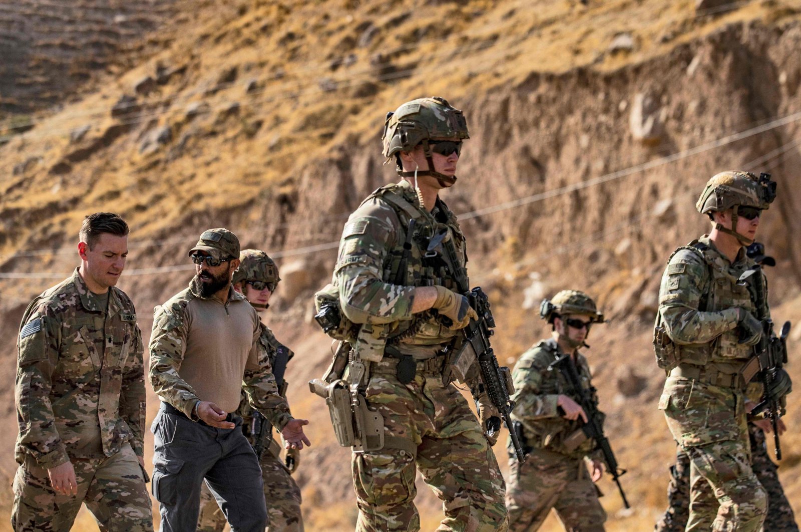 In this file photo, U.S. soldiers patrol an area near Syria&#039;s northeastern Semalka border crossing with Iraq&#039;s Kurdistan Regional Government (KRG), Nov. 1, 2021. (AFP Photo)