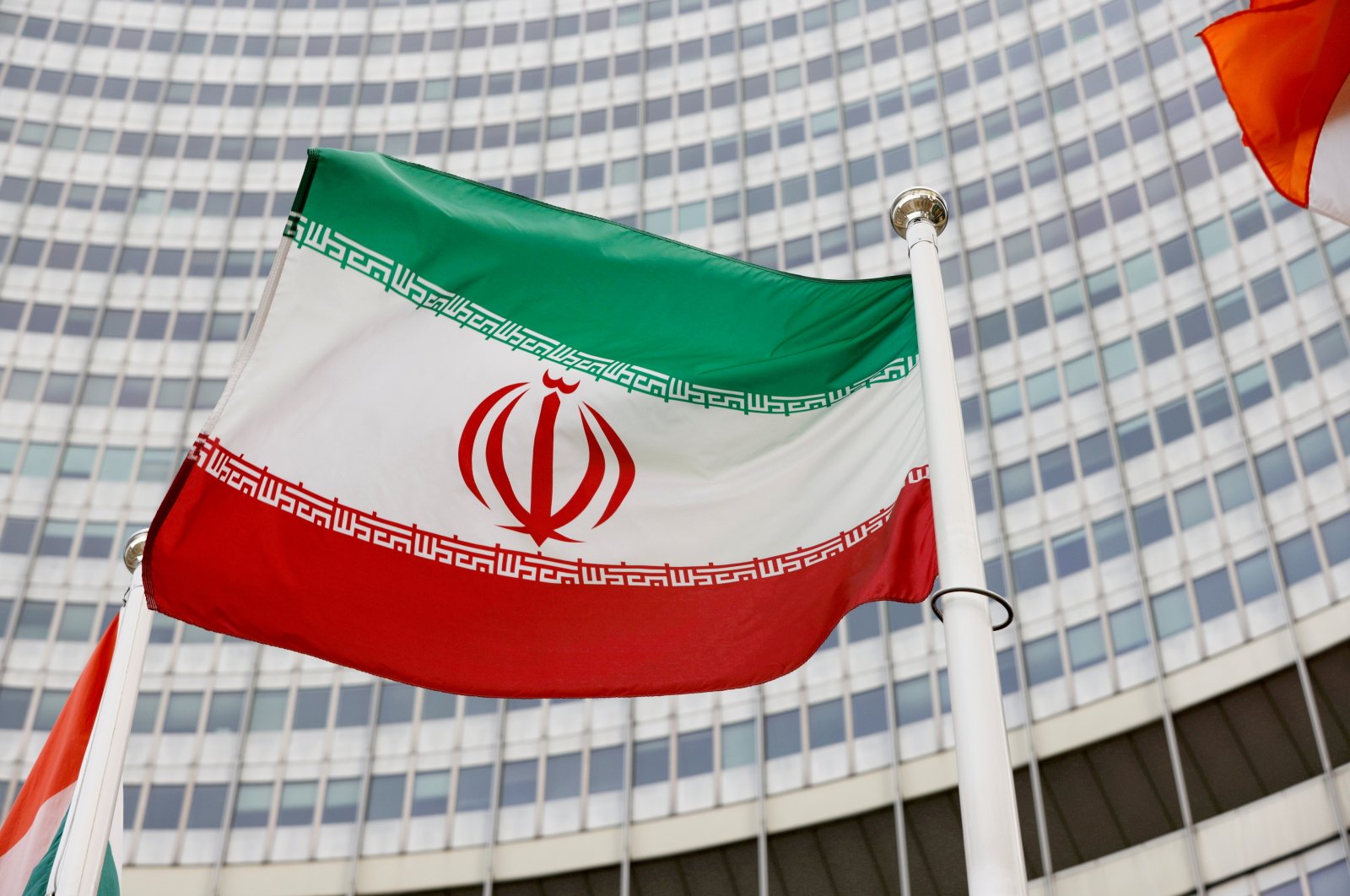 The Iranian flag waves in front of the International Atomic Energy Agency (IAEA) headquarters in Vienna, Austria, May 23, 2021. (Reuters File Photo)