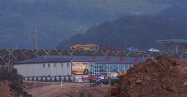 A propaganda board depicting Chinese President Xi Jinping is seen at the construction site of the Pu&#039;er high speed rail station that is part of the China-Laos railway in Pu&#039;er in Yunnan province, southwestern China, Dec. 2, 2020. (AP Photo)