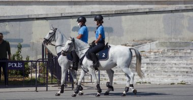 Mounted municipal police officers patrol on horseback Taksim Square, Istanbul, Turkery, July 28, 2021. (Shutterstock Photo)