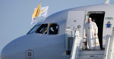 Pope Francis disembarks from the plane upon his arrival in the Greek Cypriot administration controlled city of Larnaca on the island of Cyprus, Dec. 2, 2021 (The Vatican Media handout photo via AFP)